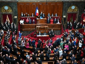 MPs and senators applaud after President of the National Assembly Yael Braun-Pivet announced the result of the vote during the convocation of a congress of both houses of parliament in Versailles, southwestern of Paris, on March 4, 2024, to anchor the right to abortion in the country's constitution.