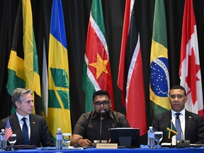 (L-R) U.S. Secretary of State Antony Blinken, Guyana President Irfaan Ali and Jamaican Prime Minister Andrew Holness attend an emergency meeting on Haiti at the Conference of Heads of Government of the Caribbean Community (CARICOM) in Kingston, Jamaica, on March 11, 2024.