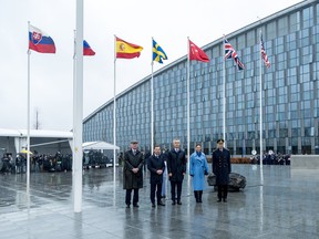 From left to right, Sweden's NATO Ambassador Axel Wernhoff, Prime Minister Ulf Kristersson, NATO Secretary General Jens Stoltenberg, Crown Princess Victoria of Sweden and Supreme Commander General Micael Bydén pose in front of the flag of Sweden and other alliance countries following Sweden's NATO accession ceremony at NATO headquarters in Brussels during a flag-raising ceremony outside NATO headquarters on March 11, 2024 in Brussels, Belgium.