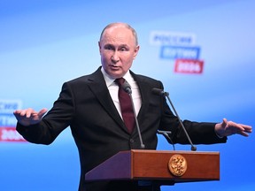 Vladimir Putin meets with the media at his campaign headquarters in Moscow on March 18, 2024.