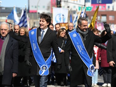Prime Minister Justin Trudeau, left, and Greek Prime Minister Kyriakos Mitsotakis take part in the Greek Independence Day Parade on Sunday, March 24, 2024 in Montreal.