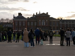 Members of the media and public gather outside Kensington Palace on March 22, 2024 in London, England.