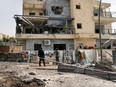 Israeli forces check the site that was hit by a Hezbollah rocket in Kiryat Shmona in northern Israel near the Lebanon border, on March 27, 2024.