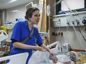 Pediatrician Tanya Haj-Hassan examines wounded Gazan children at Al-Aqsa Martyrs Hospital in Deir al-Balah, central Gaza. Saturday, March 16, 2024.