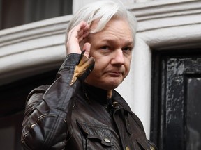 In this file photo taken on May 19, 2017 Wikileaks founder Julian Assange speaks on the balcony of the Embassy of Ecuador in London on May 19, 2017.