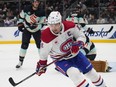 Canadiens centre Nick Suzuki (14) skates away after scoring against the Seattle Kraken on Sunday, March 24, 2024, in Seattle.