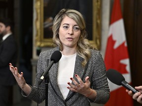 Minister of Foreign Affairs Melanie Joly speaks in the Foyer of the House of Commons on Parliament Hill in Ottawa, on Friday, March 1, 2024.