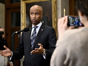 International Development Minister Ahmed Hussen speaks in the Foyer of the House of Commons before Question Period on Parliament Hill in Ottawa, Thursday, Feb. 15, 2024.