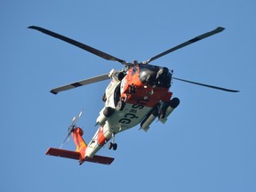 Photo of a U.S. Coast Guard helicopter in the air.