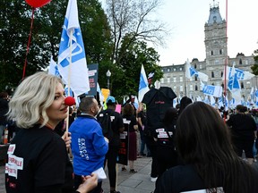Union members of the Federation interprofessionnelle de la sante du Quebec (FIQ) march to the National Assembly to demonstrate in Quebec City on Oct. 2, 2023.