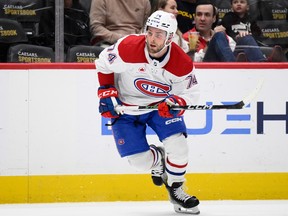 Brandon Gignac is seen skating near the boards while holdign his stick with both hands and wearing the Canadiens' white road jersey.