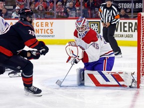 Hurricanes' Sebastian Aho has his shot go wide of Canadiens goaltender Sam Montembeault Thursday night in Raleigh, N.C.