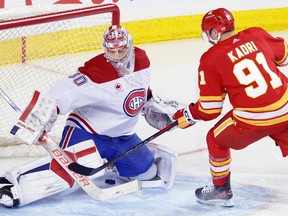Canadiens goalie Cayden Primeau is scored on by Flames' Nazem Kadri in Calgary on Saturday, March 16, 2024.
