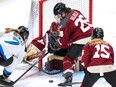 Toronto's Olivia Knowles (7) can't get her stick on a rebound in front of Montreal goalie Ann-Renée Desbiens, centre, with Sarah Bujold (26) defending during the first period of an PWHL hockey game in Pittsburgh on Sunday, March 17, 2024.