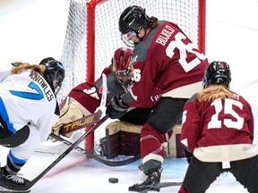 Toronto's Olivia Knowles (7) can't get her stick on a rebound in front of Montreal goalie Ann-Renée Desbiens, centre, with Sarah Bujold (26) defending during the first period of an PWHL hockey game in Pittsburgh on Sunday, March 17, 2024.