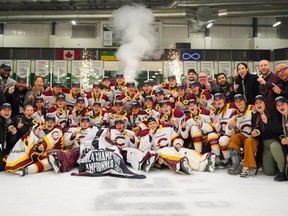 Stingers players, coaches and staff pose for a photograph after beating the Varsity Blues 3-1 to win the women's university hockey final in Saskatoon on Sunday night.
