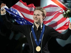 Ilia Malinin of the United States celebrates his gold medal during the victory ceremony for the free skate in the men's competition at the 2024 ISU World Figure Skating Championships in Montreal on Saturday, March 23, 2024.