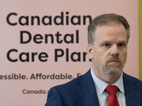 Minister of Health Mark Holland listens to a question following an announcement on dental care, Monday, Dec. 11, 2023 in Ottawa.