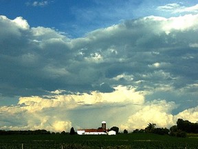 Clouds hang over a farm