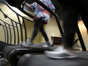 Gym members use as treadmill to warm up for a morning exercise class.