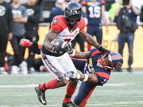 Najee Murray of the Montreal Alouettes, right, tackles Quan Bray of the Ottawa Redblacks during the first half of CFL football action in Montreal, Saturday, June 10, 2023. It cost him the chance to play in the Gray Cup, but Murray is grateful for his late-season pec.  The injury occurred when he did.