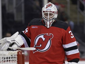 New Jersey Devils goaltender Jake Allen (34) before the first period of an NHL hockey game against the Winnipeg Jets on Thursday, March 21, 2024, in Newark, N.J.