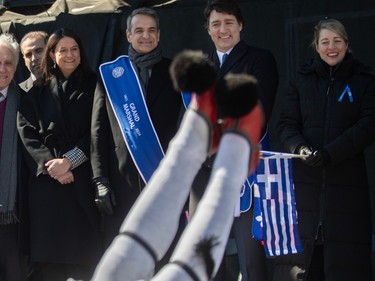 Prime Minister Justin Trudeau (second from right) and Greek Prime Minister Kyriakos Mitsotakis watch performers from the reviewing stand during the 2024 Greek Independence Day Parade on Sunday, March 24, 2024.