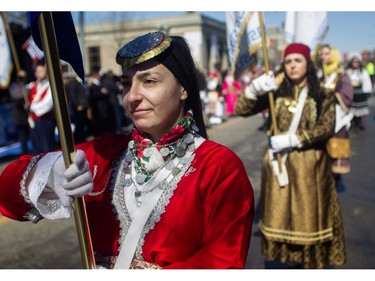 Women in traditional dress take part in the Greek Independence Day Parade on Sunday, March 24, 2024, in Montreal.