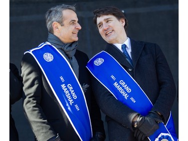Prime Minister Justin Trudeau (right)  and Greek Prime Minister Kyriakos Mitsotakis share a laugh on the reviewing stand during the 2024 Greek Independence Day Parade on Sunday, March 24, 2024.