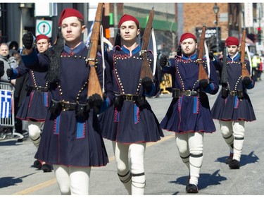 Men dressed as traditional Evzones take part in the Greek Independence Day Parade on Sunday, March 24, 2024, in Montreal.