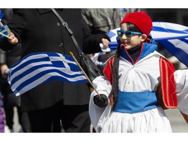 A youngster takes part in the Greek Independence Day Parade on Sunday, March 24, 2024. The parade event was presented by Hellenic Community of Greater Montreal.