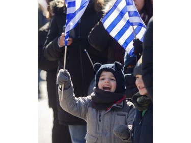 Andreas Di Zazzo (left) and Thanasis Xipoleas  enjoy the 2024 Greek Independence Day Parade on Sunday, March 24, 2024, in Montreal. The parade event was presented by Hellenic Community of Greater Montreal.
