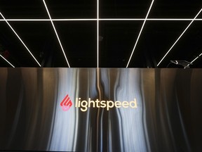 the lightspeed logo is seen on an office wall