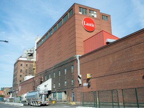 A large brick building with a red Lantic logo on its side