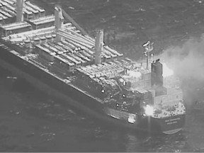 This black-and-white image released by the U.S. military's Central Command shows the fire aboard the bulk carrier True Confidence after a missile attack by Yemen's Houthi rebels in the Gulf of Aden on Wednesday, March 6, 2024.