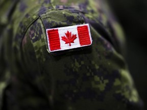 A Canadian soldier takes part in an announcement at Garrison Petawawa in Petawawa, Ont., on Thursday, Oct. 19, 2023.
