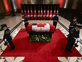 Sentinels surround the casket of former prime minister Brian Mulroney as he lies in state at the Sir John A. Macdonald Building, across from Parliament Hill in Ottawa, on Tuesday, March 19, 2024.