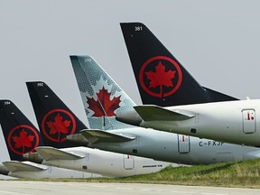 Grounded Air Canada planes sit on the tarmac at Pearson International Airport during in Toronto on Wednesday, April 28, 2021.