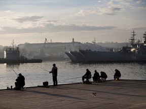Local fishermen try their luck in front of Russia Navy ships in Sevastopol, Crimea, in this file photo.