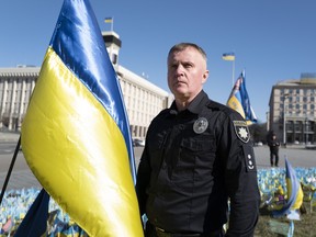 Ukrainian police officer Volodymyr Nikulin poses for a photo in downtown Kyiv, Monday on March 11, 2024.