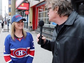 Gazette reporter Brendan Kelly talks to Canadiens fan Jennifer Lane outside McLean's Pub in Montreal.