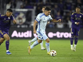 CF Montreal is used to embarking on long road trips early in the season. However, the beginning to the 2024 campaign is the most skewed since the team's arrival in Major League Soccer. CF Montreal forward Matias Coccaro, centre, controls the ball in front of Orlando City midfielder Cesar Araujo, left, during an MLS soccer match, in Orlando, Fla., Saturday, Feb. 24, 2024.