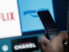 A television remote control shows buttons to access streaming services Netflix and Amazon Prime, in a photo illustration made in Toronto, Friday, March 22, 2024.
