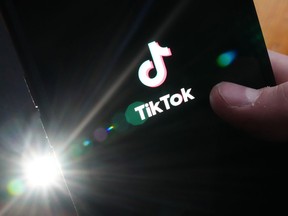 The TikTok startup page is displayed on a cellphone in Ottawa on Monday, Feb. 27, 2023.