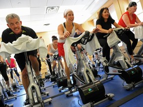 People in a spinning class at a New York Sports Clubs gym generate electricity that is returned to the building's energy grid as they work out on April 29, 2010 in New York.