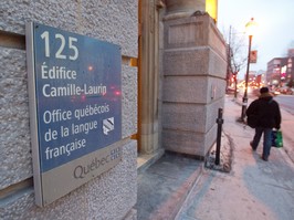 A sign on a building indicates it's the head office of the OQLF.