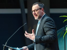 French language minister Jean-François Roberge speaks at a lectern.