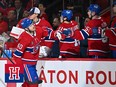 Joel Armia fist bumps his Montreal Canadiens teammates on the bench after scoring a goal