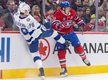Montreal Canadiens' Brendan Gallagher checks Tampa Bay Lightning's Emil Lilleberg along the boards