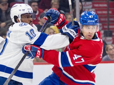 Montreal Canadiens' Jayden Struble tussles with Tampa Bay Lightning's Anthony Duclair